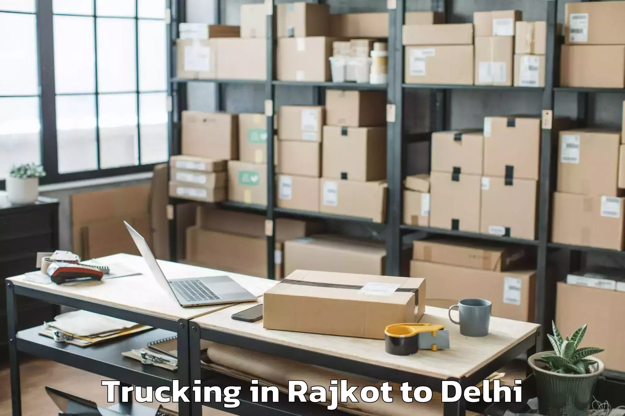 Easy Rajkot to Naraina Industrial Estate Trucking Booking